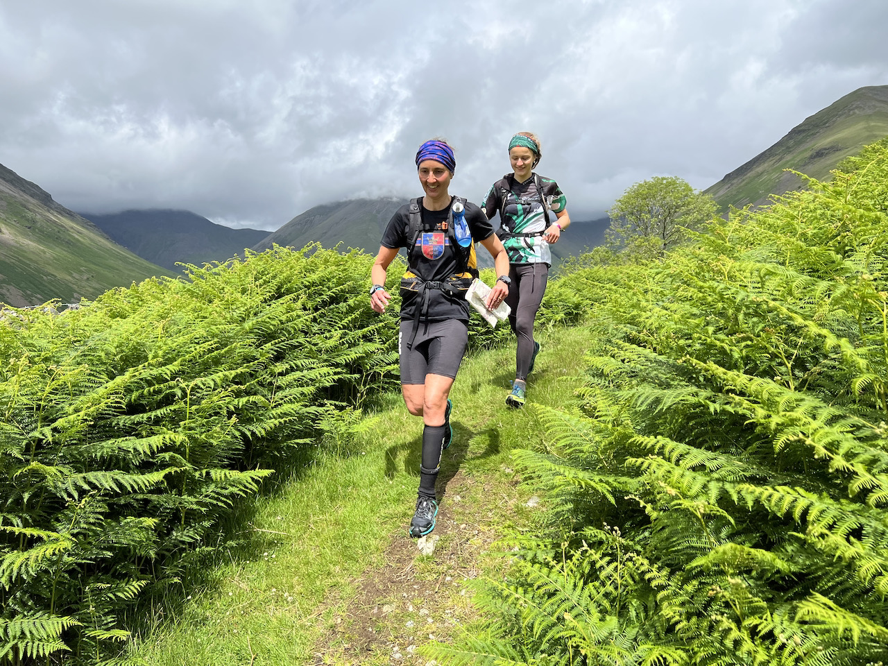 Two runners on a path through bracken
